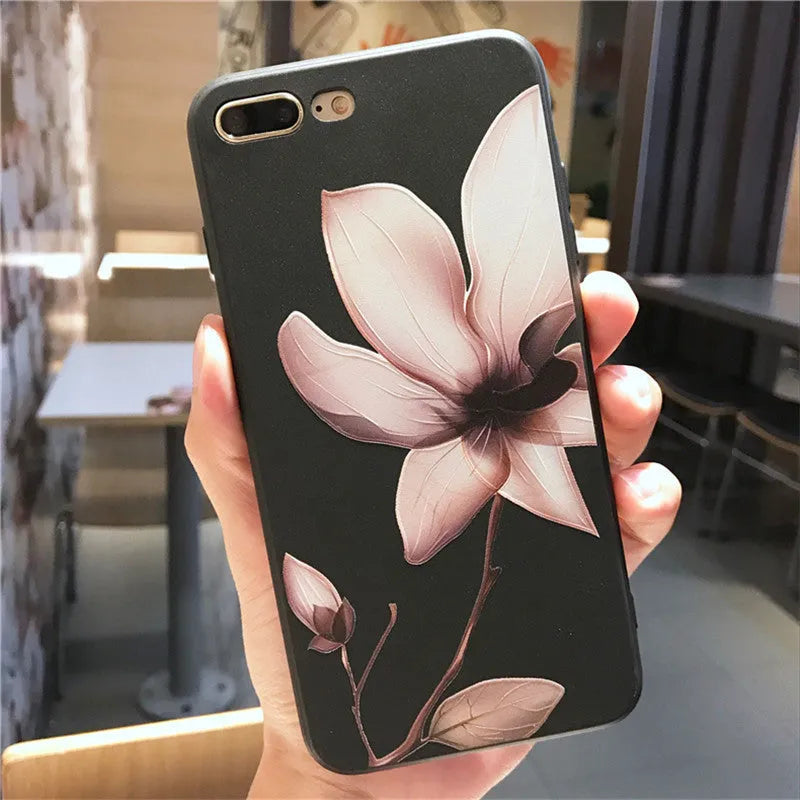 Embossed floral design on a black TPU iPhone case for iPhone 11.