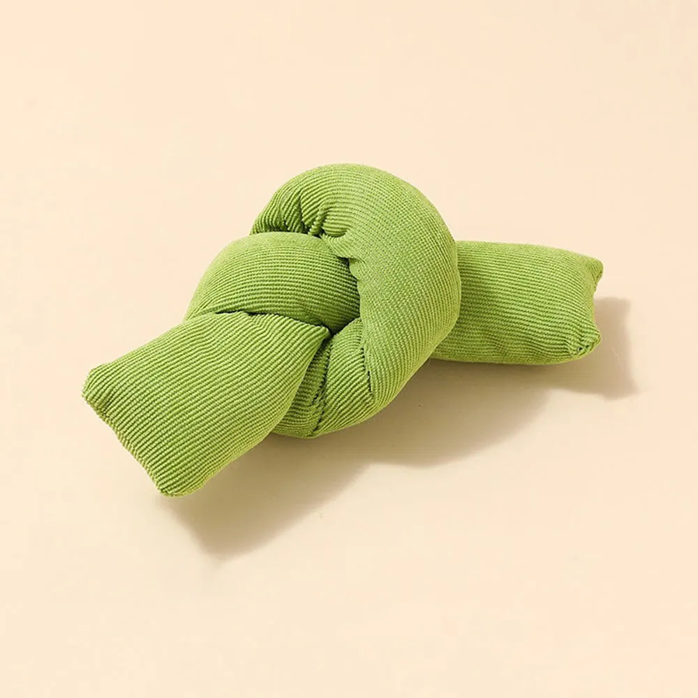 White knotted cotton rope dog toy for tugging and chewing.