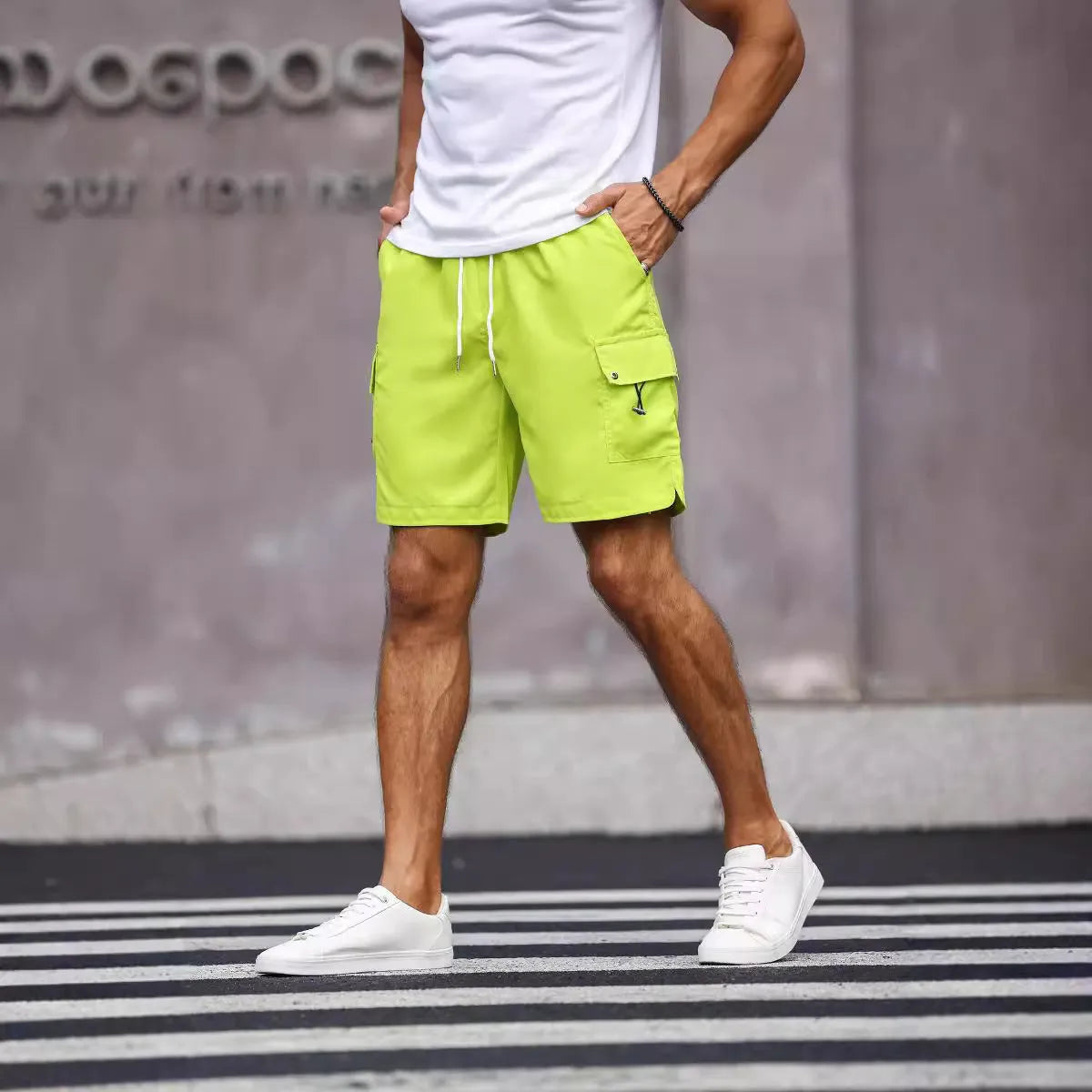Men's loose fit workwear shorts in fluorescent green and army green colours with straight leg design