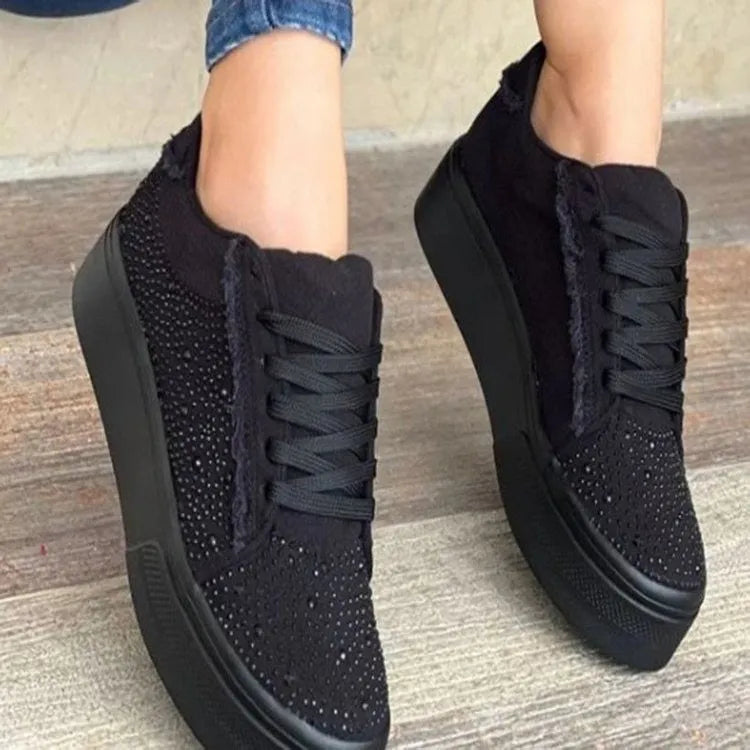 Plus size women's black lace-up casual pump with rhinestone detail on side, chunky flat rubber sole.
