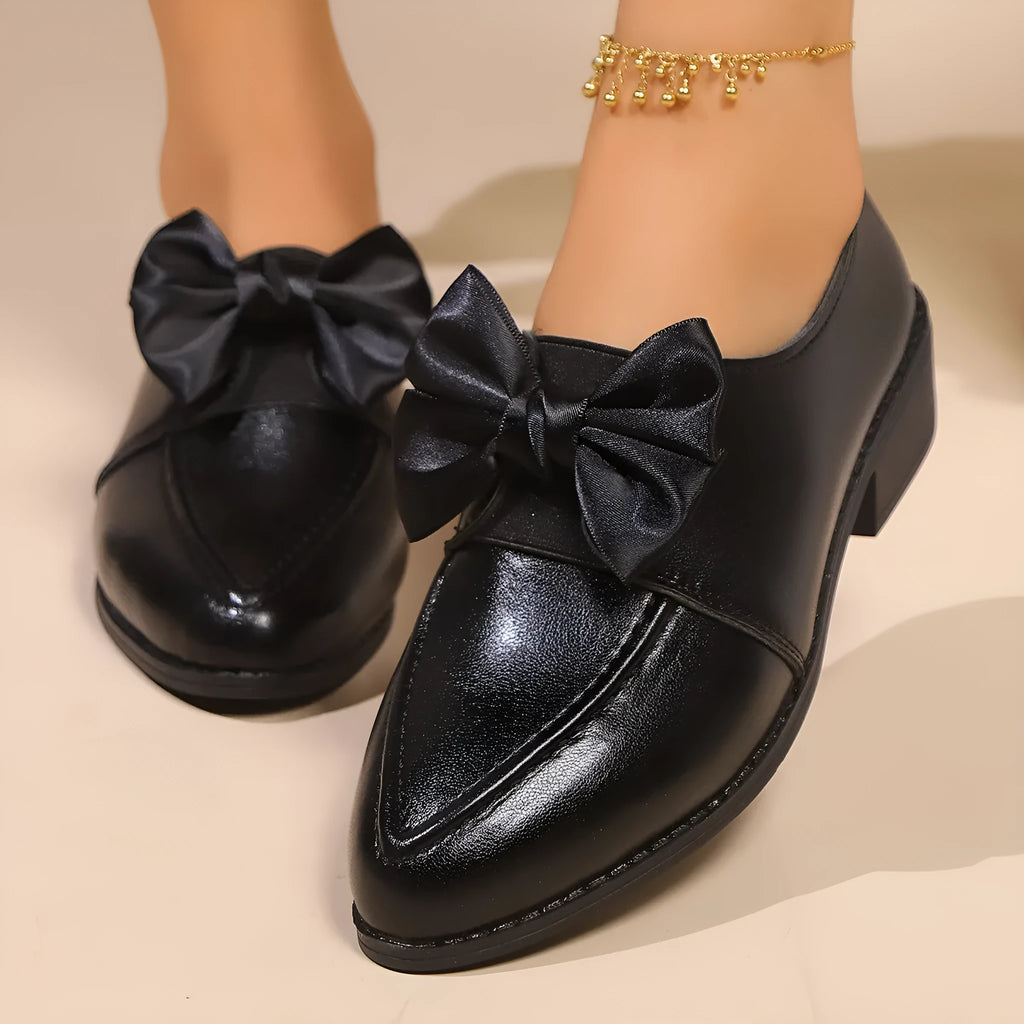 Women's British-style leather shoes with bow detail showing PU upper and rubber sole construction