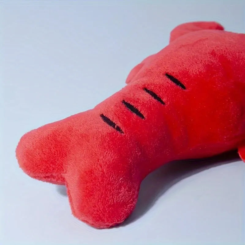 Red lobster-shaped squeaky plush dog toy for small and medium breeds.
