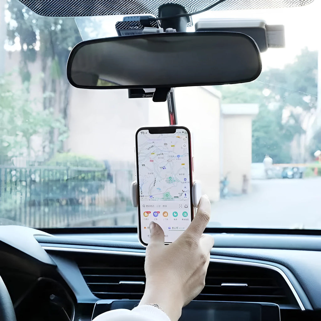 Black ABS plastic mobile phone bracket mounted on car rearview mirror holding a smartphone