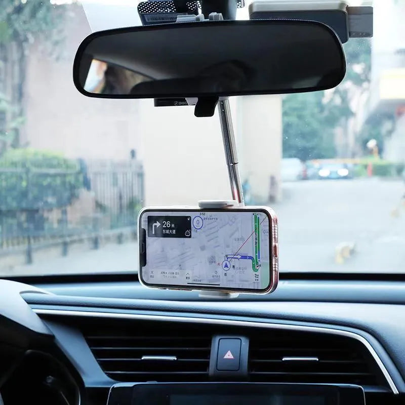 Black ABS plastic mobile phone bracket mounted on car rearview mirror holding a smartphone