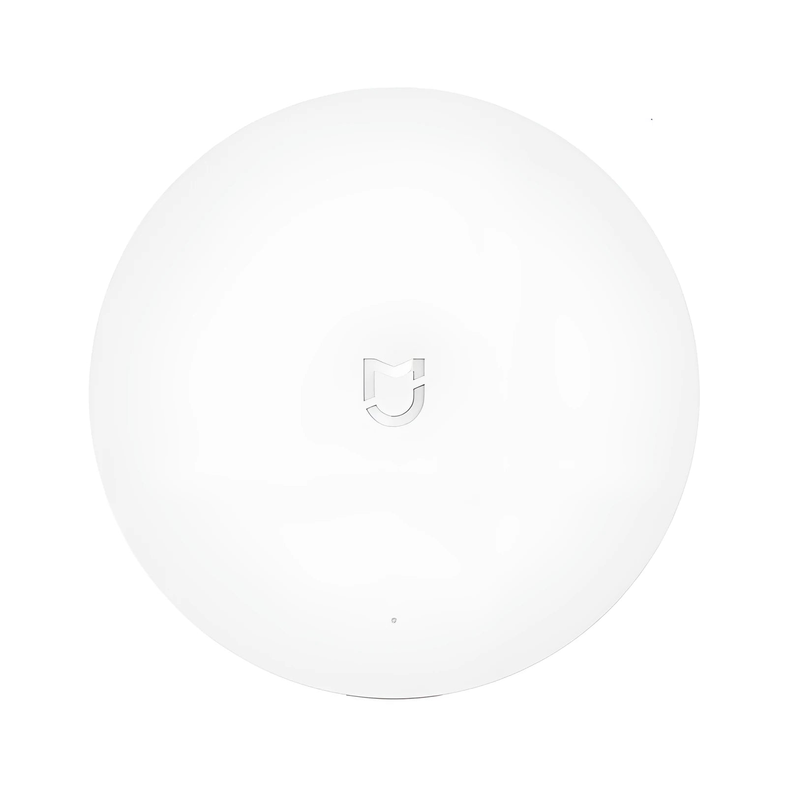 White circular Xiaomijia smart home gateway with UK plug for wall mounting.