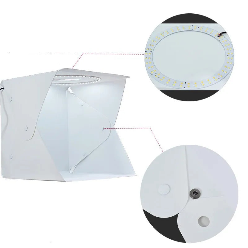 40cm folding studio LED soft light box with adjustable colour temperature and six colourful background cloths laid out.