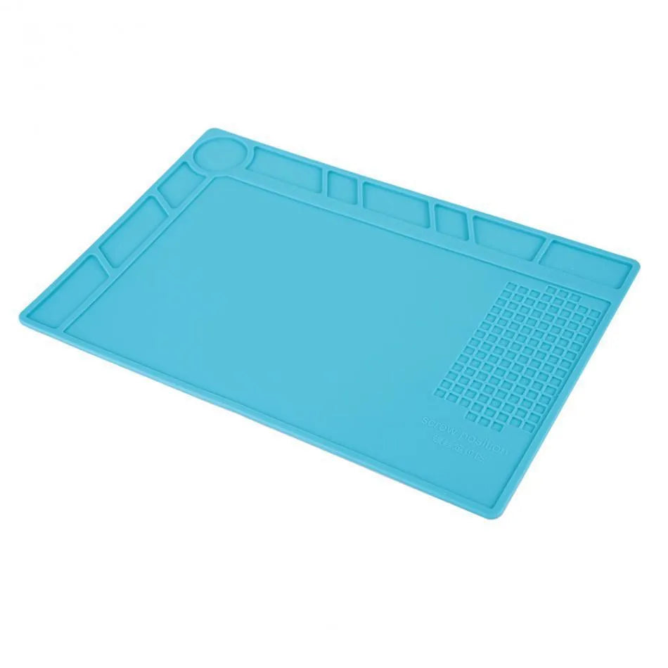 Blue silicone anti-skid pad for watch repair on a workbench, showing non-slip surface