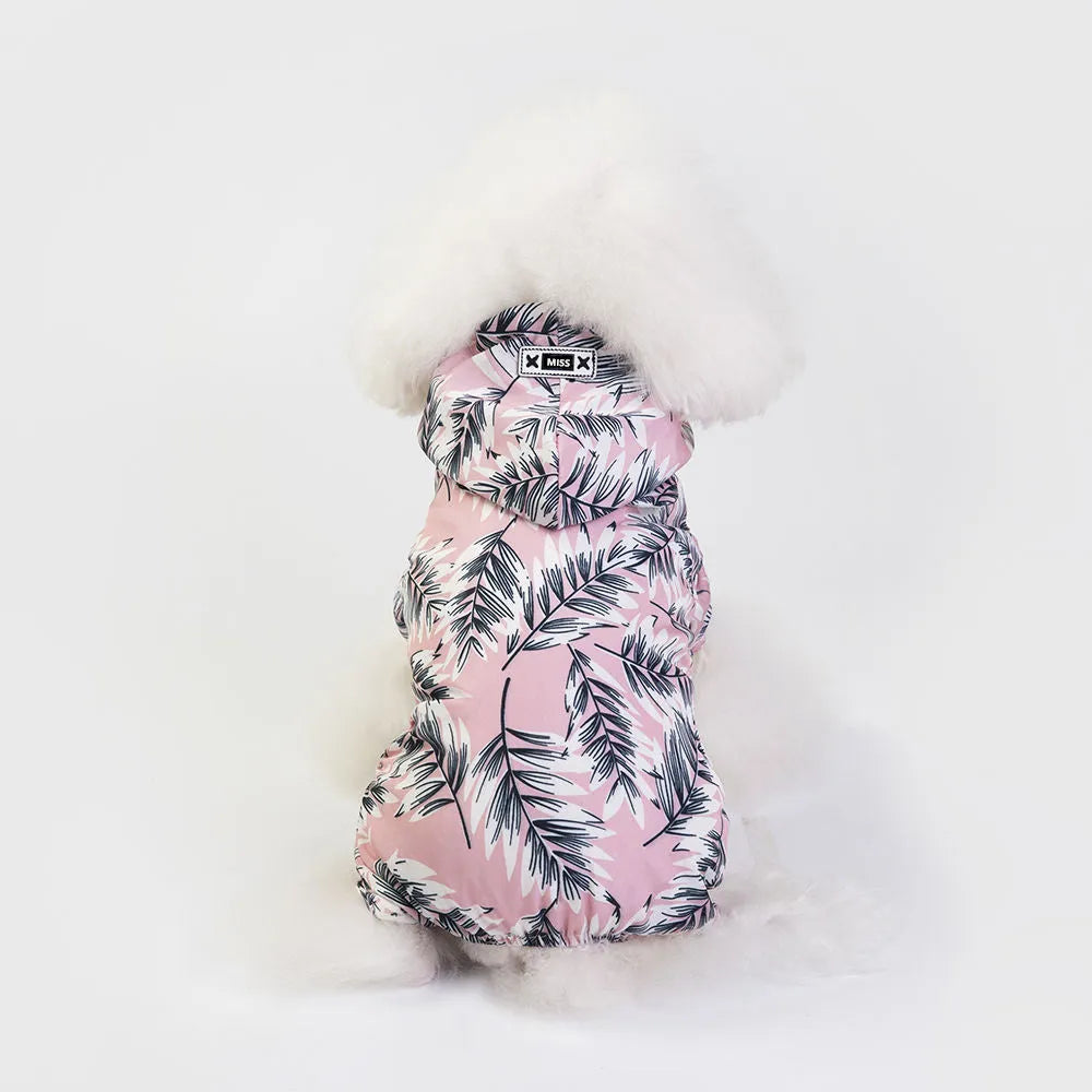 Waterproof dog raincoat in pink, four-legged jumpsuit style, on a small dog