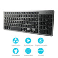 Thin black Bluetooth keyboard with 104 keys next to tablet showing wireless connection