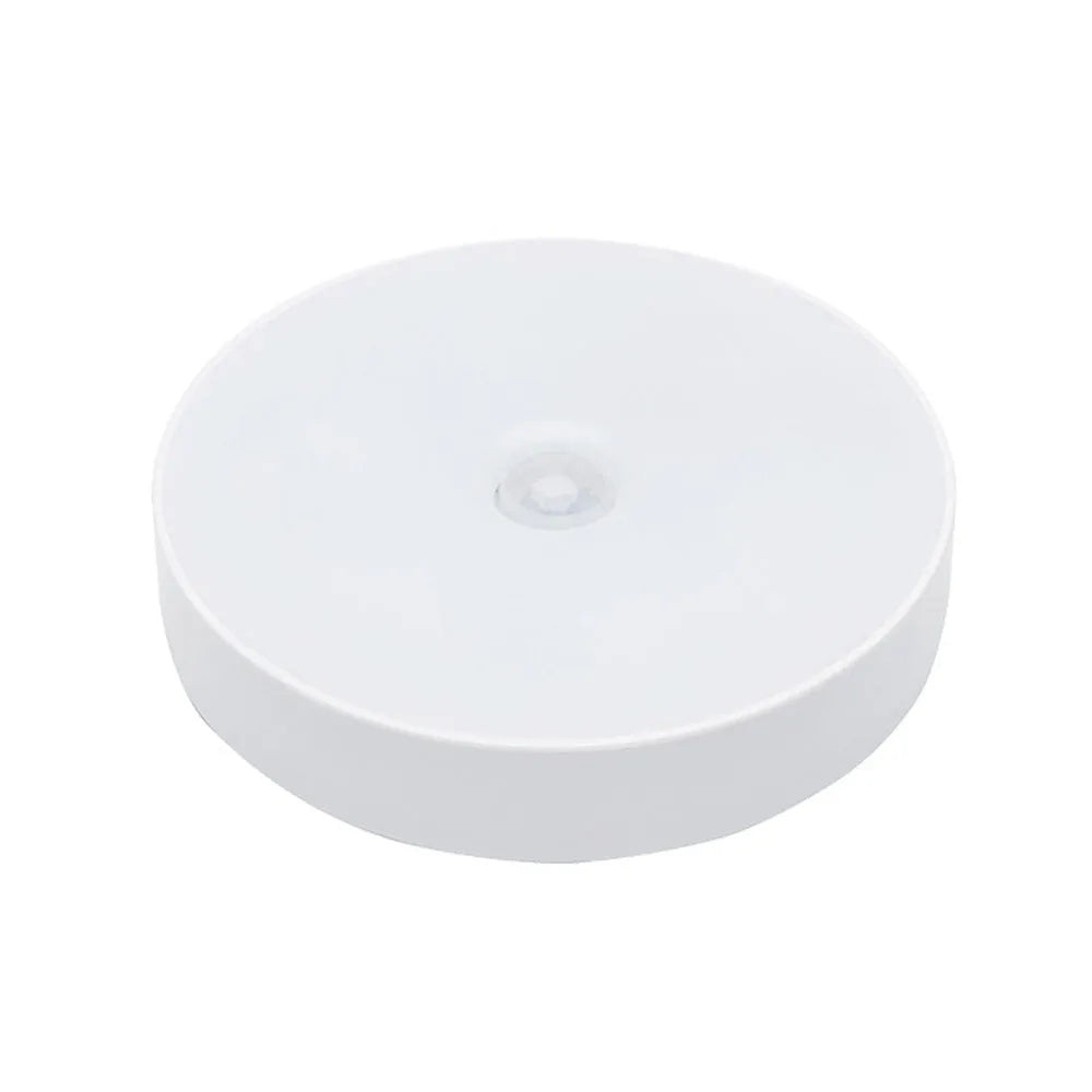 White circular motion sensor LED night light with USB charging cable and adhesive tape