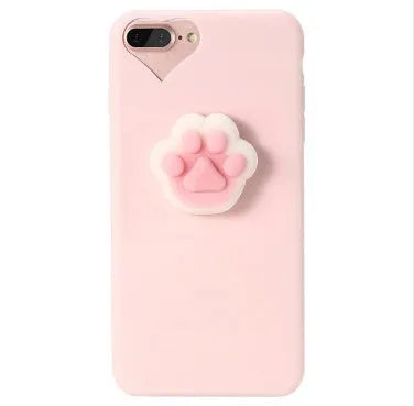 A soft pink silicone iPhone case featuring a raised 3D cartoon cat design on the back.