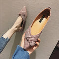Women's pointed toe single shoes in black or red with shallow mouth design and low flat heel