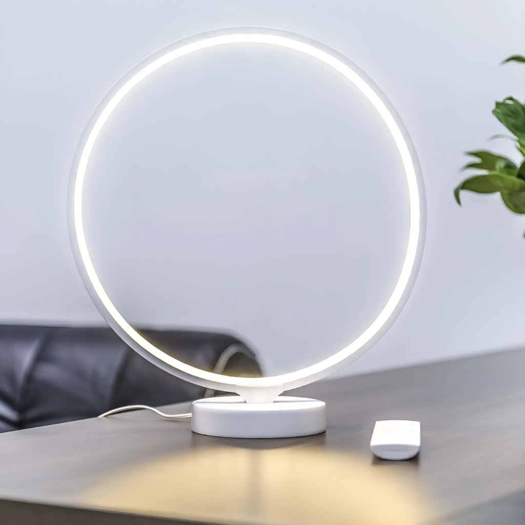 White Full Moon Mood Lamp table light with remote control on a surface.