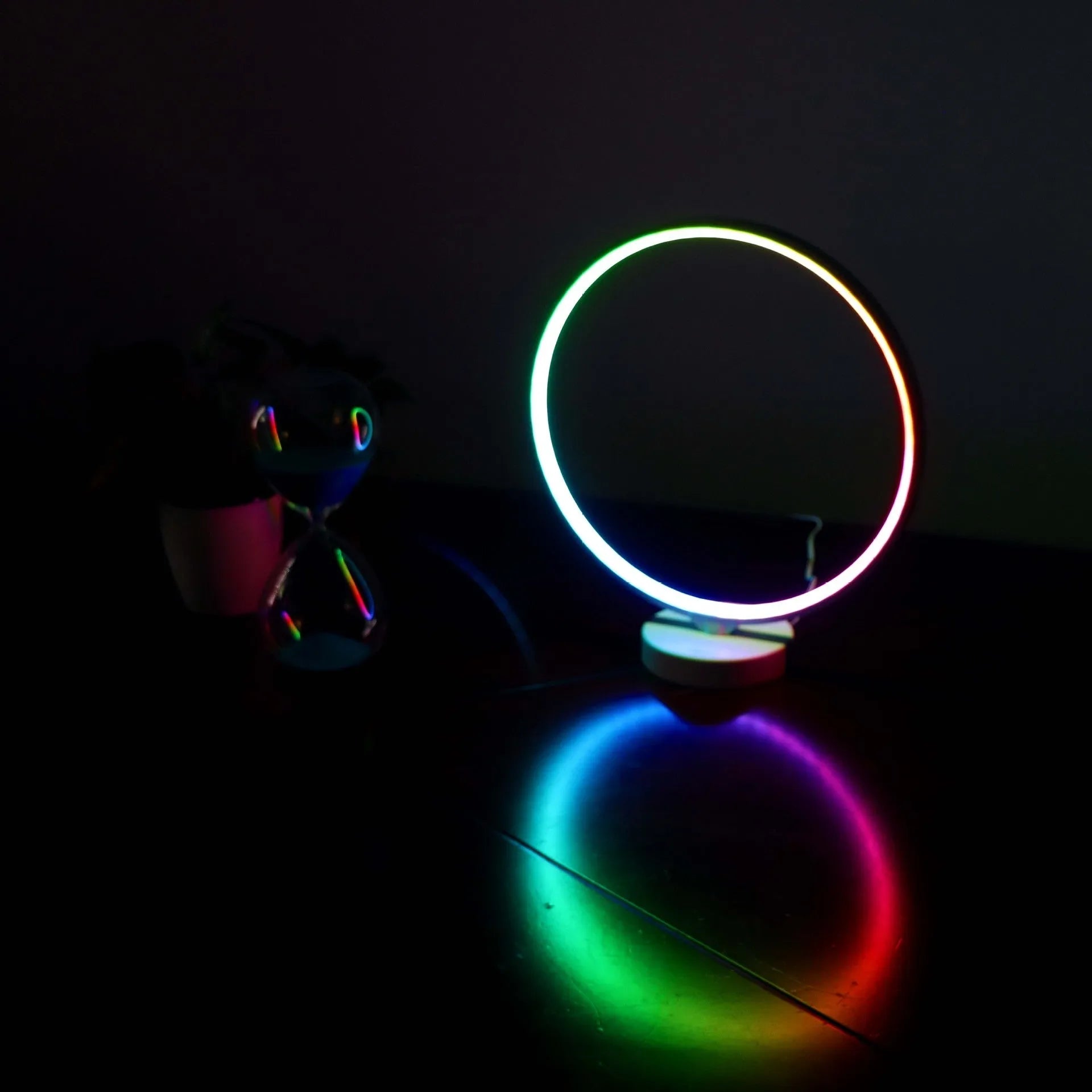 White Full Moon Mood Lamp table light with remote control on a surface.