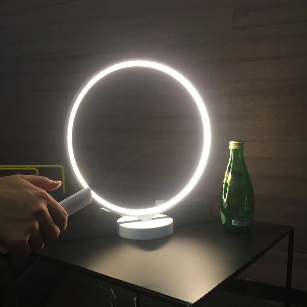 White Full Moon Mood Lamp table light with remote control on a surface.