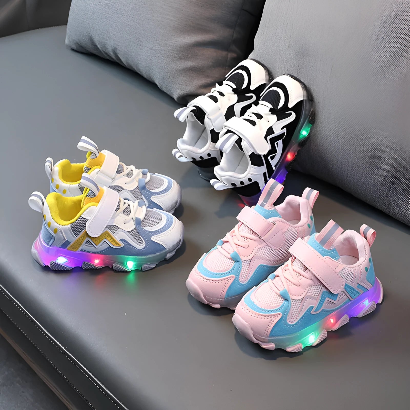 Children's bright light mesh sneakers with Velcro closure in black, grey, and pink colours