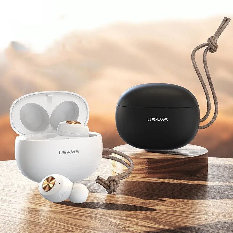 Pebble Series white mini TWS wireless Bluetooth earbuds and charging case on a grey background