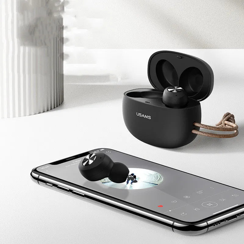 Pebble Series white mini TWS wireless Bluetooth earbuds and charging case on a grey background
