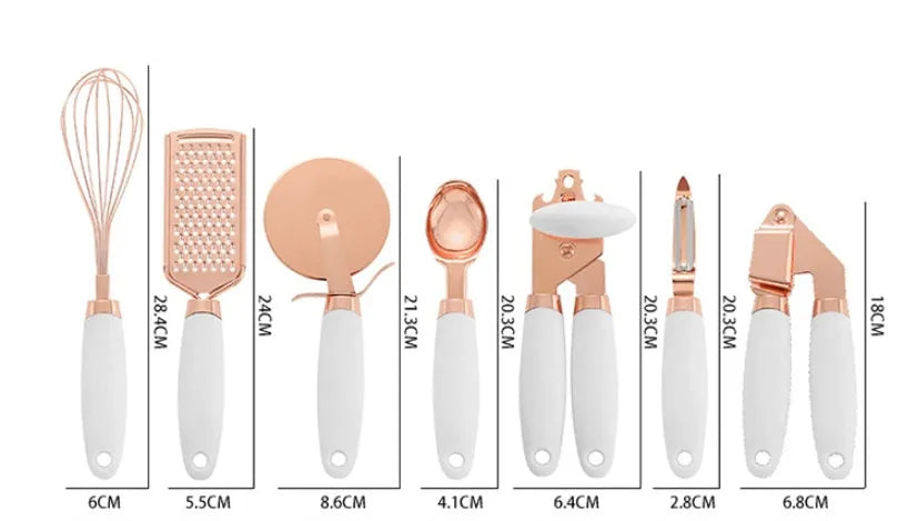 7-piece stainless steel kitchen tool set with copper plating peeler gadget in a cutlery rack on a countertop