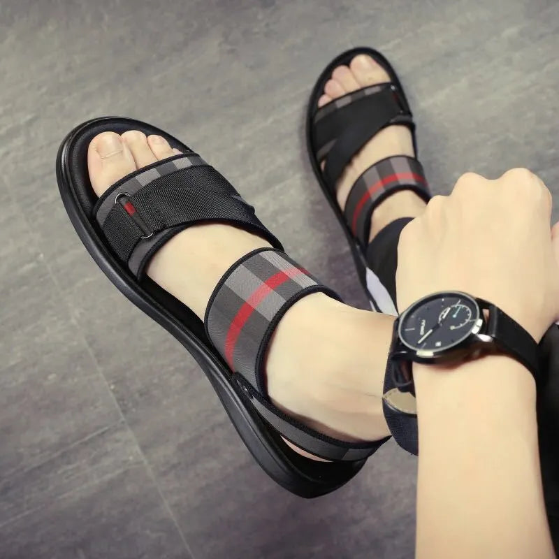 Youth sports sandals with elastic Lycra fabric upper and polyurethane sole, shown in a casual setting.