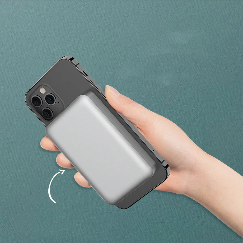 Silver aluminium magnetic wireless power bank for iPhone charging, showing slim profile and MagSafe ring.