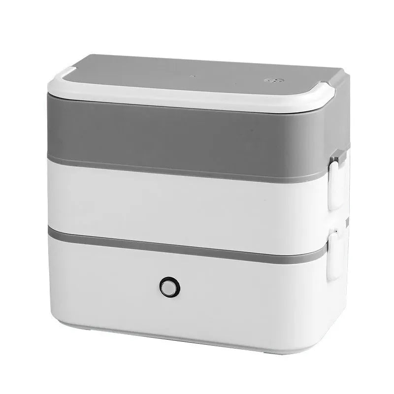 Pink and white portable heated lunch box with plug and push-button control.