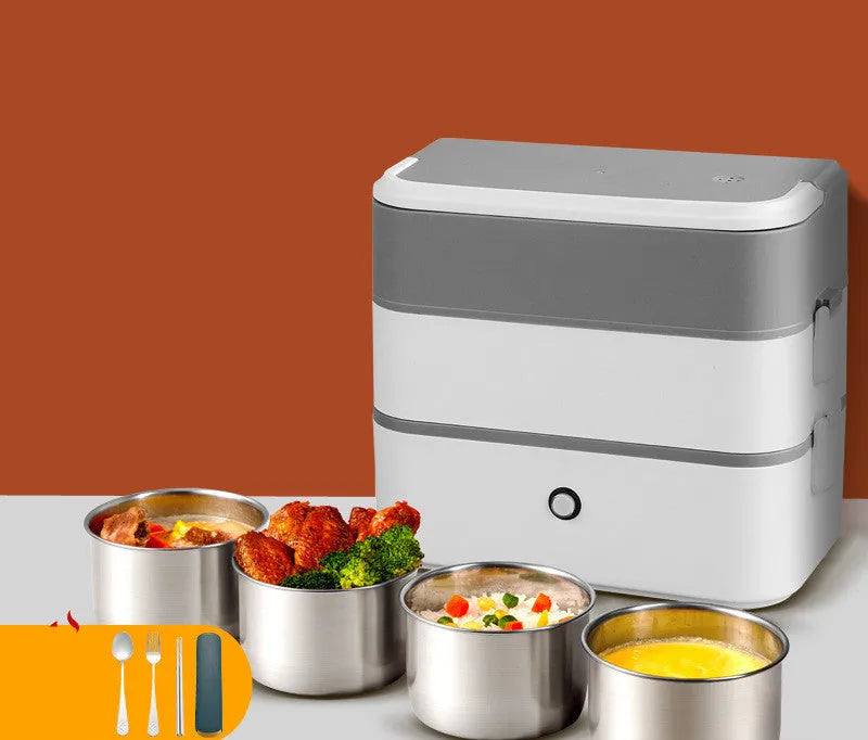 Pink and white portable heated lunch box with plug and push-button control.