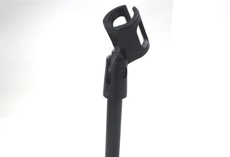 Black metal desktop microphone bracket with a circular base and plastic clip.