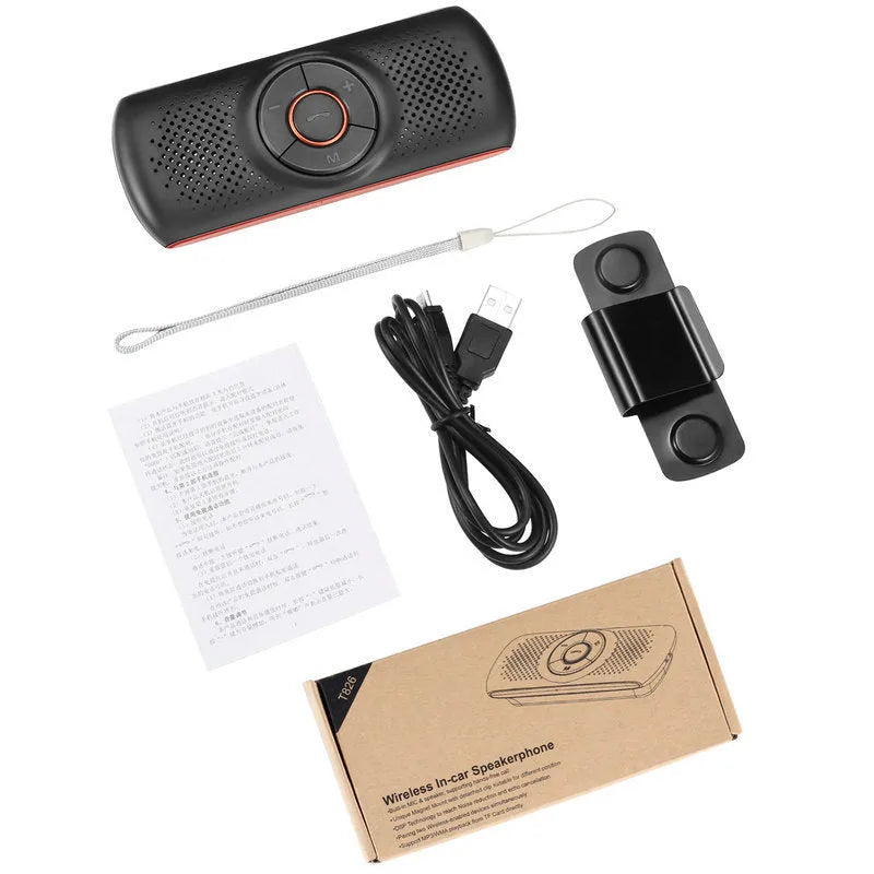 Orange plastic Bluetooth hands-free car speaker mounted on a sun visor for wireless phone calls and music.