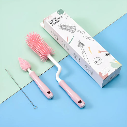 Silicone baby bottle cleaning brush and separate straw cleaner in pink, blue, and yellow colours.