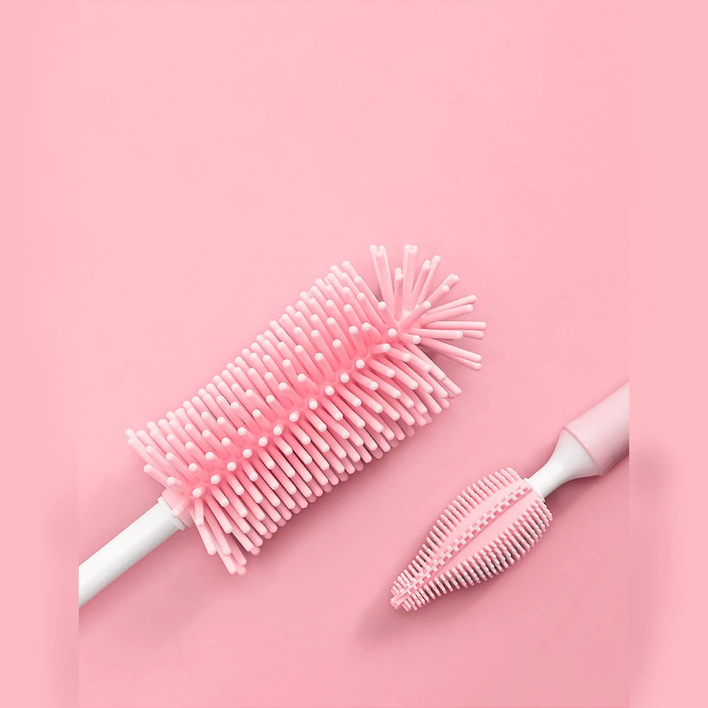 Silicone baby bottle cleaning brush and separate straw cleaner in pink, blue, and yellow colours.