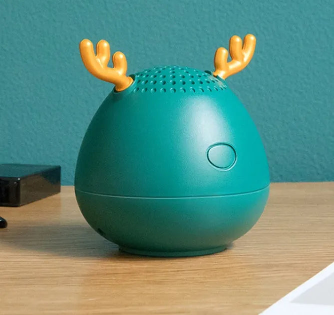 Compact Bluetooth speaker in green colour showing front speaker grille and USB port