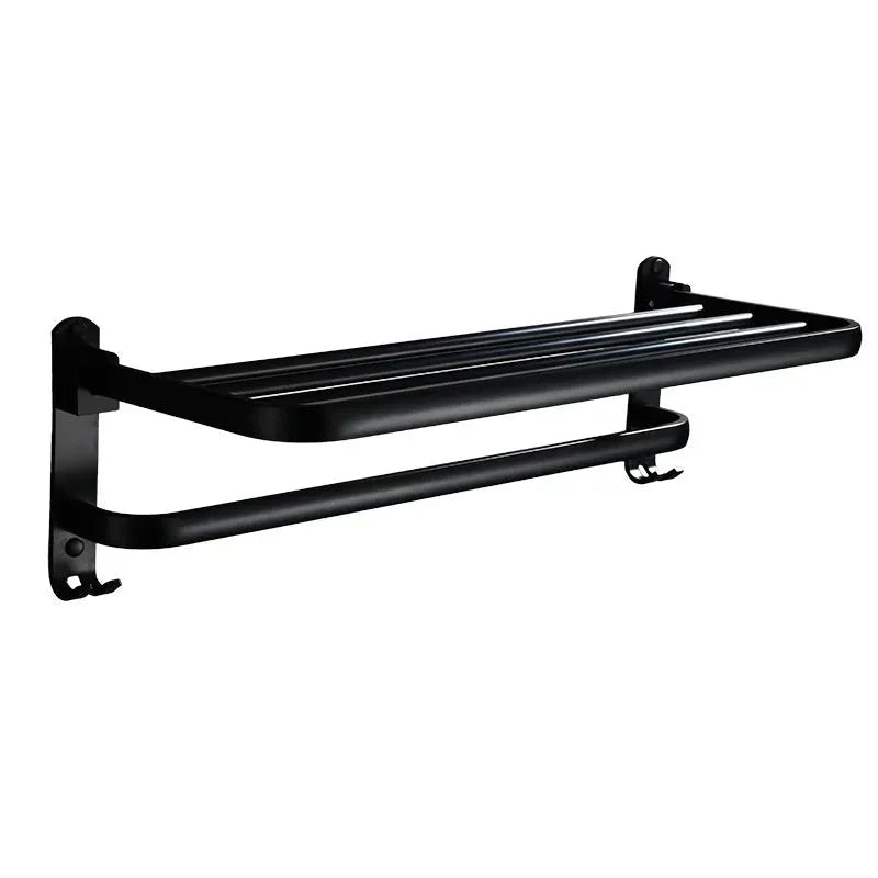 Silver aluminium double-decker folding bathroom shelf with towels, mounted on a wall.