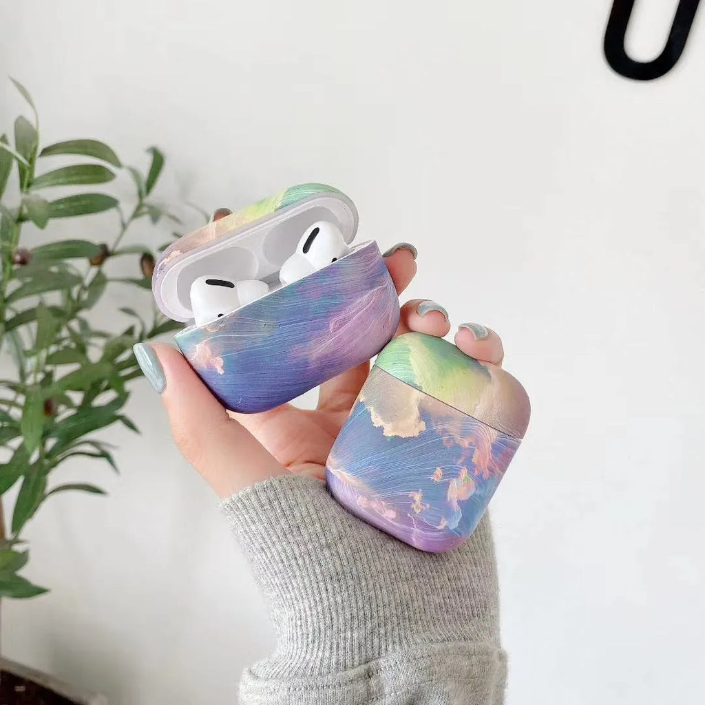 Hard shell protective case for Apple AirPods with watercolour design in pink or blue colours