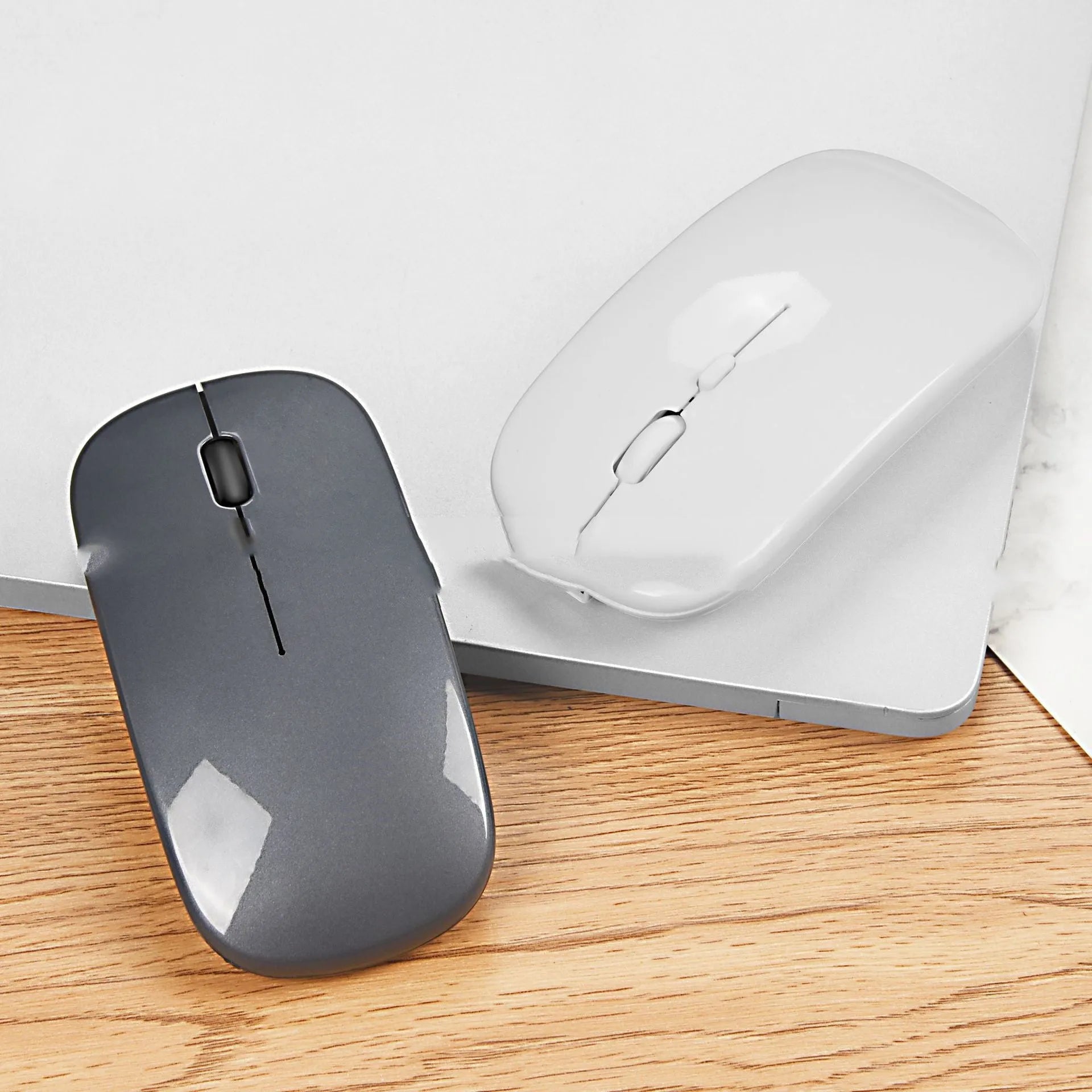 Bluetooth dual-mode rechargeable silent wireless mouse in Black, Gold, Grey, Rose Gold, Silver, White on a desk