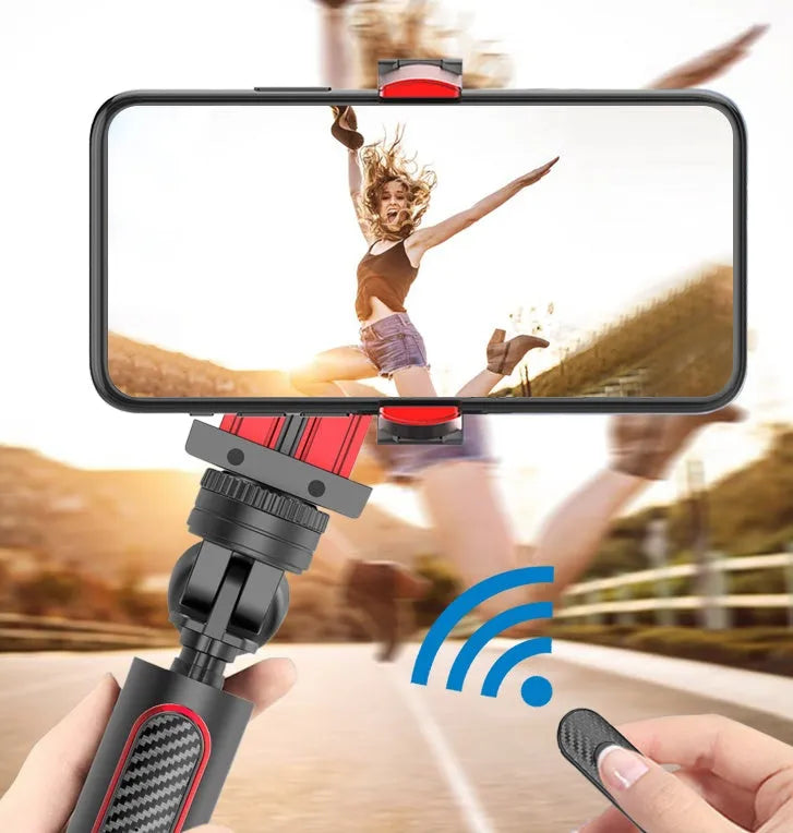 Black aluminium self timer tripod with extended legs and iPhone mounted in adjustable clamp