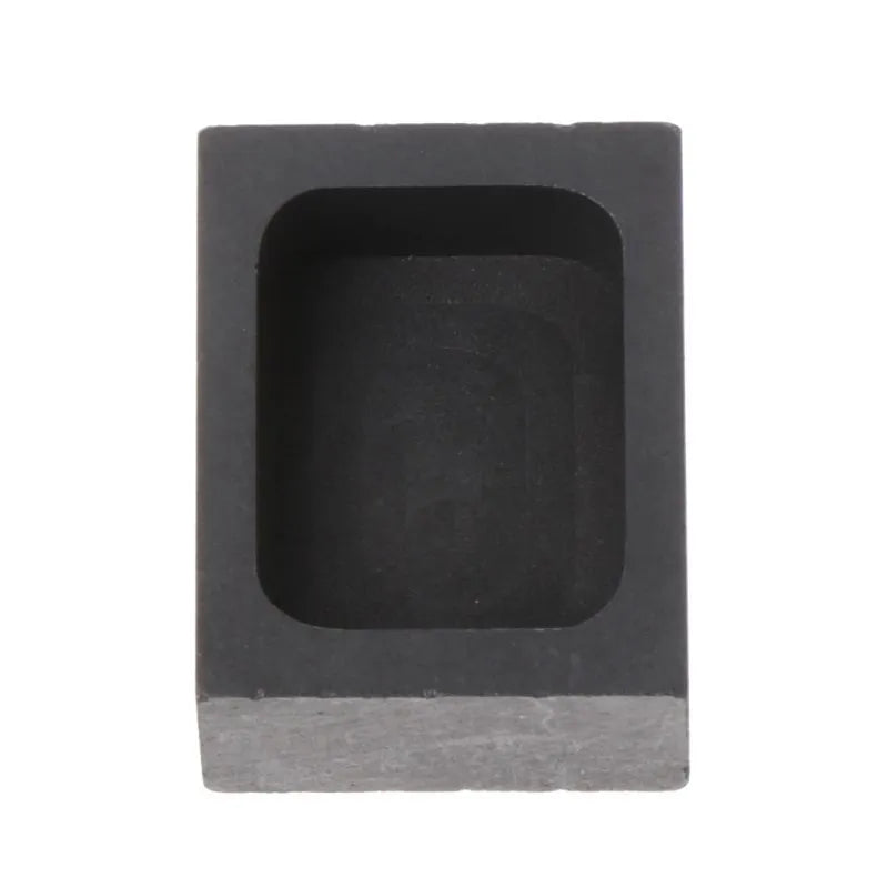 Square high-purity graphite crucible for melting gold, silver, and platinum on a work surface.