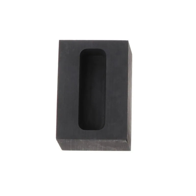 Square high-purity graphite crucible for melting gold, silver, and platinum on a work surface.