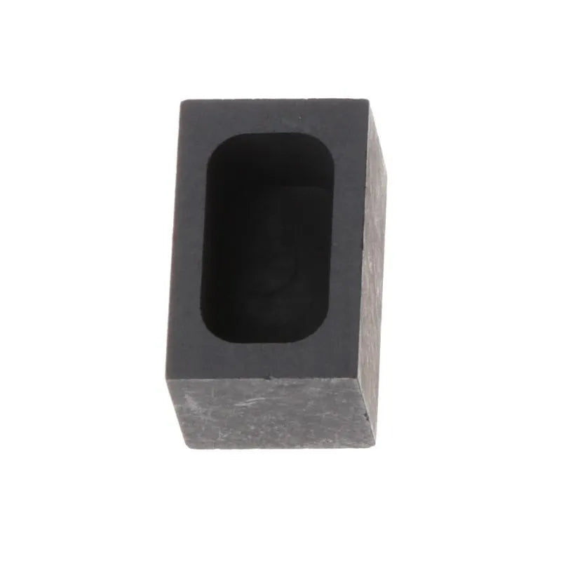 Square high-purity graphite crucible for melting gold, silver, and platinum on a work surface.
