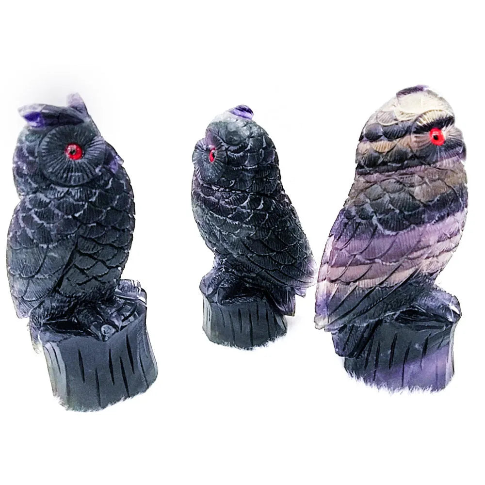 Purple fluorite hand-carved owl ornament approximately 4 inches tall with natural stone colour variations