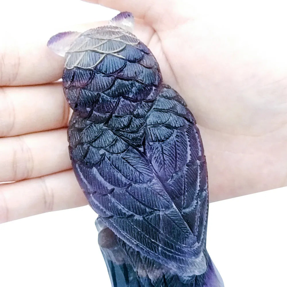 Purple fluorite hand-carved owl ornament approximately 4 inches tall with natural stone colour variations
