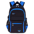 Green water-resistant nylon school backpack for students, showing side mesh pocket and multiple compartments.