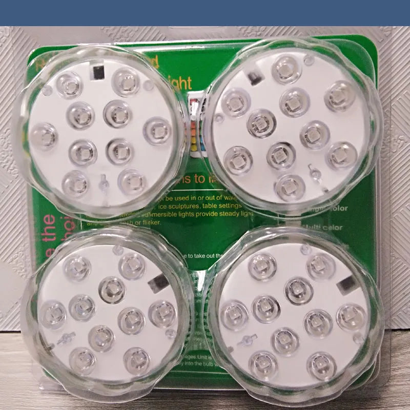 White circular IP68 waterproof RGB LED light with remote control for pools and gardens.
