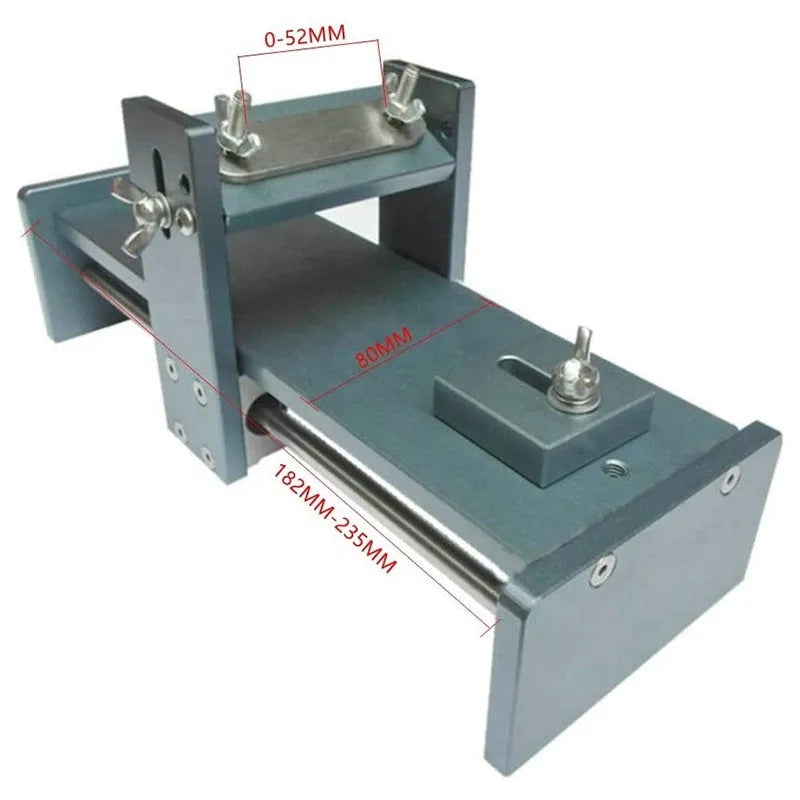 Aluminium and stainless steel fixed angle sharpening tool for chisels and planers on a workbench.