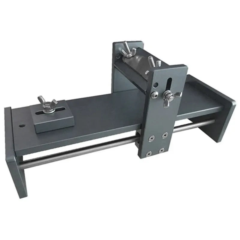 Aluminium and stainless steel fixed angle sharpening tool for chisels and planers on a workbench.