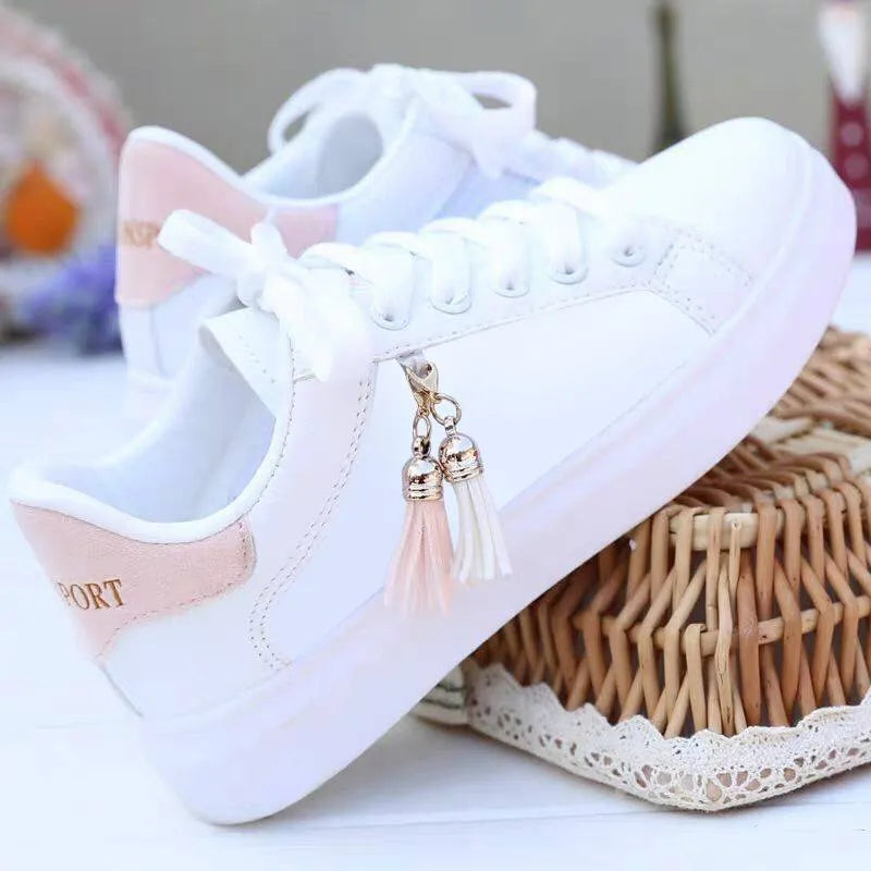 White women's mesh fashion trainers with lace-up front and flat rubber sole.