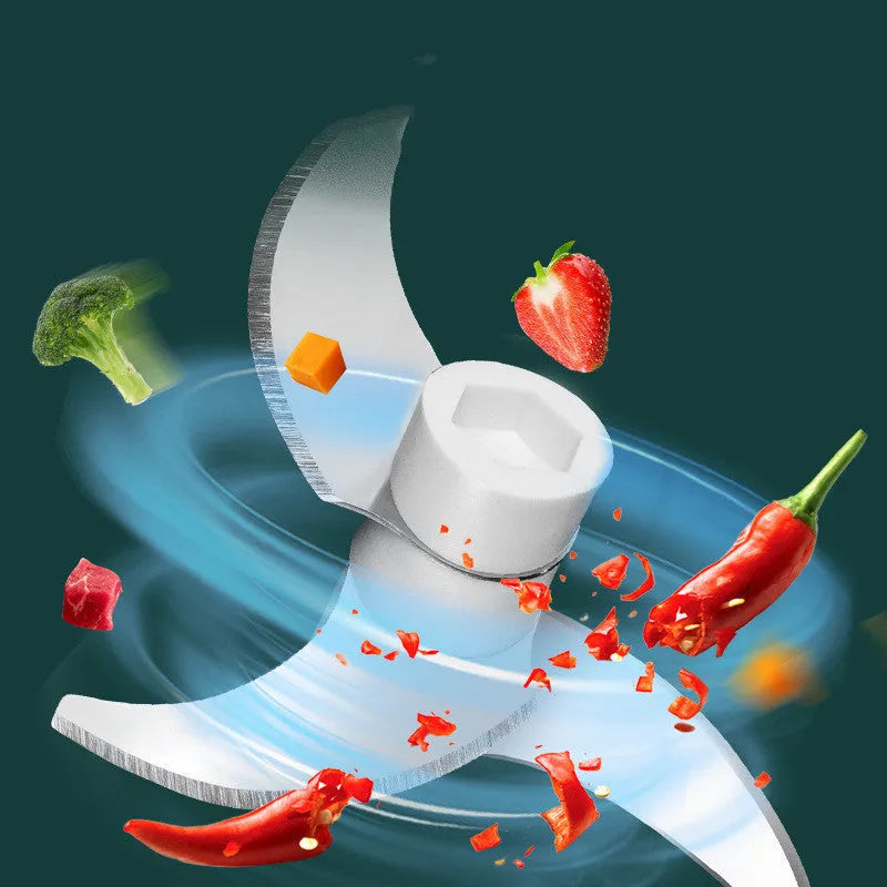 Portable electric mini garlic cutter with transparent cup and stainless steel blade on kitchen counter