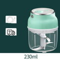 Portable electric mini garlic cutter with transparent cup and stainless steel blade on kitchen counter