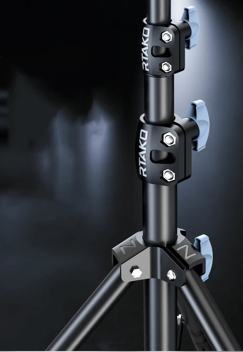 Carbon steel mobile phone tripod with a 10-inch ring light attached, shown next to its storage bag.