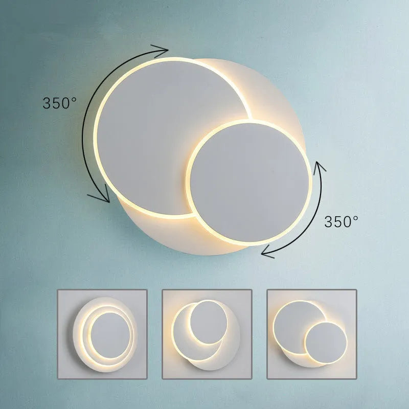 Modern round acrylic wall lamp in black or white, shown in large, medium and small sizes.